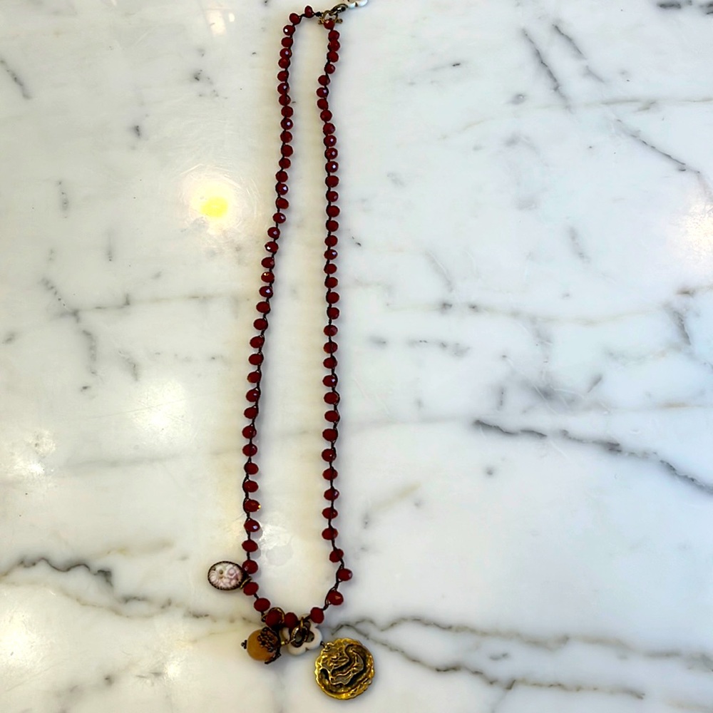 Bead necklace with charms.